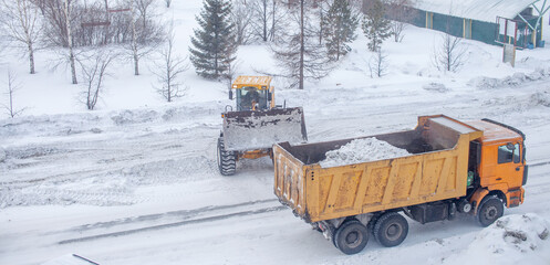 Cleaning and cleaning of roads in the city from snow in winter