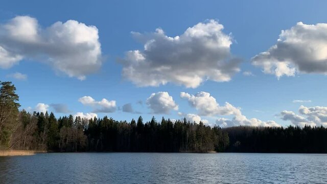 Camping Site By Tranquil Lake Under Cloudy Blue Sky -  Wide Shot