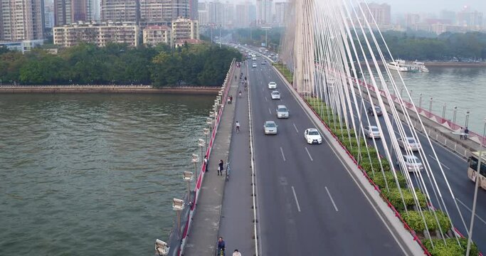 Traffic moving along the bridge over Pearl river in the afternoon. Guangdong, China.