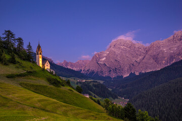 Fototapeta na wymiar Europe, Italy, Dolomites, Val di Funes. Chapel of St. Barbara at sunset.