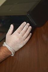 man's hands check an inkjet printer. Printer technician