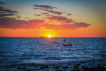 Orange afternoon landscape with boat