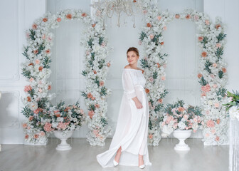 portrait of a pregnant woman in a white dress