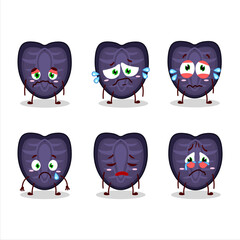 Slice of black strawberry cartoon character with sad expression