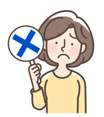 バツ印を掲げる女性