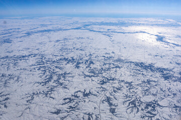 Snowy plains with mountain ridges