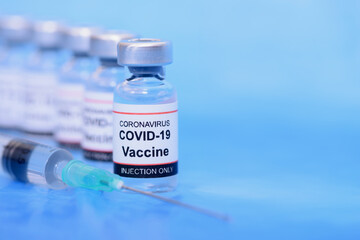 Vaccine and Healthcare Medical concept. Vaccines and syringe on blue background for prevention,immunization and treatment from corona virus infection
