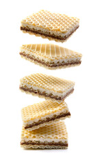 Levitating waffles are isolated on a white background. Delicious crisp waffles.
