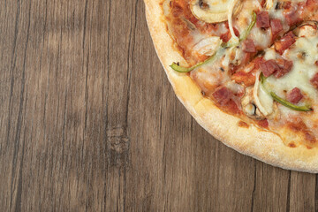 Pizza with mixed ingredients and melted cheese on the top