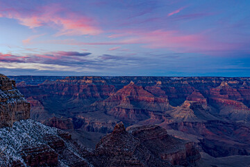 Sunset light on the Grand Canyon landscape and the clouds above