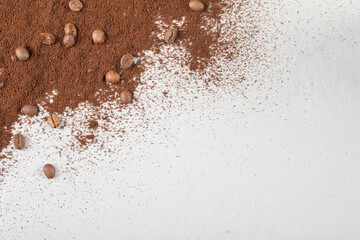 Fototapeta na wymiar Coffee beans on the blended coffee or cocoa powder