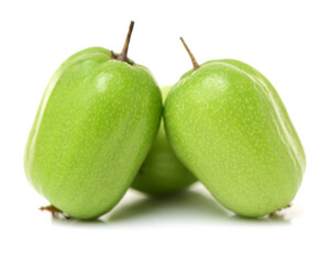 mini kiwi baby fruit (actinidia arguta) on white background 
