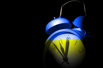 Colorful alarm clock on dark background