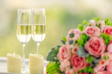 Sweet color rose bouquet with two glasses of wine, love, dating and anniversary concept
