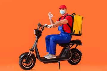 Fototapeta na wymiar Courier of food delivery service showing OK on color background