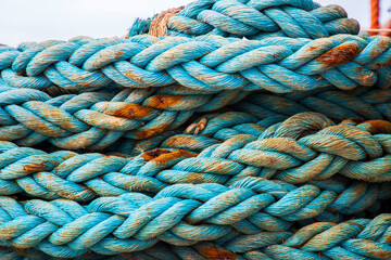 Italy, Sicily, Agrigento Province, Sciacca. Ropes on a fishing boat in the harbor of Sciacca, on the Mediterranean Sea. - obrazy, fototapety, plakaty