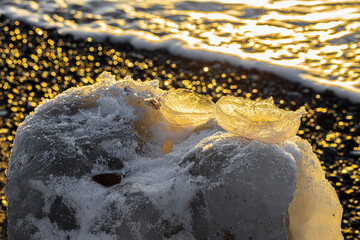 pebbles are frosted at the sea