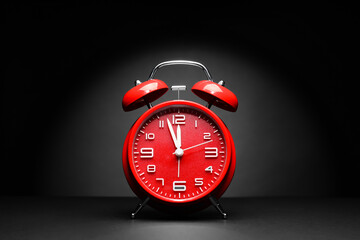 Alarm clock on black background