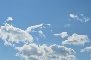 Naklejka na ściany i meble white cloud shapes on blue summer sky