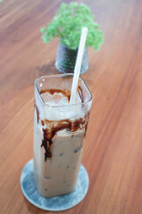 Iced chocolate mocha on wooden table