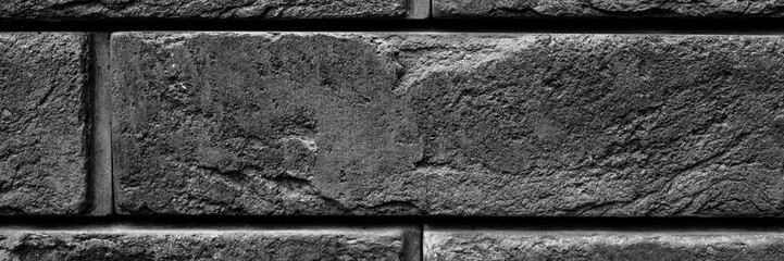 pattern of decorative black slate stone wall surface as a background. banner