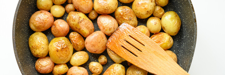 Golden roasted potatoes in the skin. banner