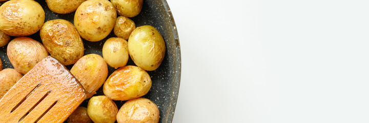 Golden roasted potatoes in the skin. banner