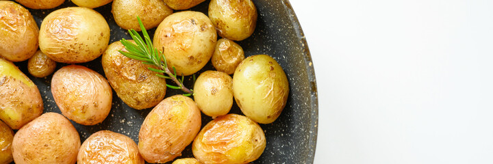 Golden roasted potatoes in the skin. banner