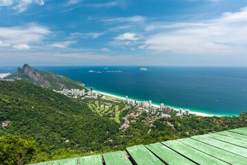 Beautiful scenery from above of free flight ramp overlooking the São Conrado beach, emerald sea...