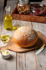 Side view on loaf of olive oil bread on the wooden table