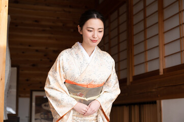 A beautiful Japanese woman offering hospitality.