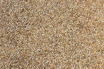 Top view of little pebbles in beige tons.