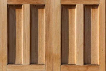 Detail of a Japanese wooden door used in a temple illuminated by a beautiful sunlight.