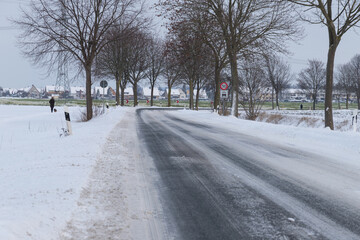 snowy bend in a village  in wintertime