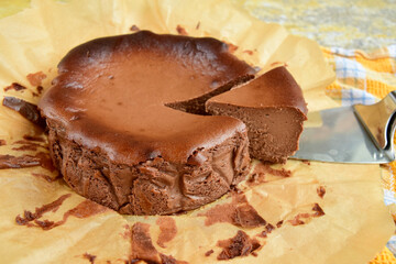 Homemade delicious chocolate burnt cheesecake on parchment paper. 