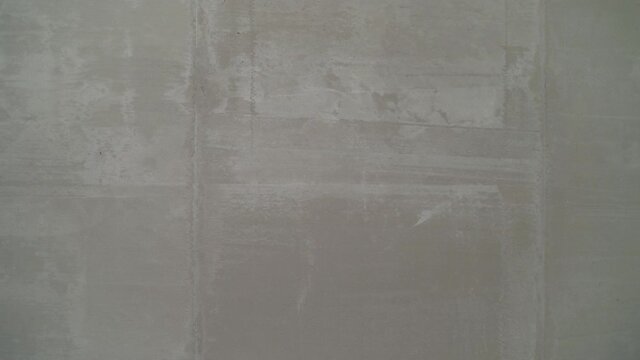 Plastering wall. Texture of a wall made of gray mortar.