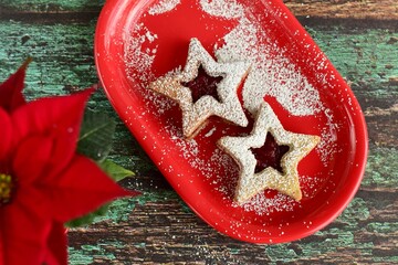 Christmas Linzer cookies with raspberry jam and powdered sugar. Flat lay