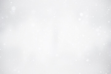 blurred snow / winter abstract background, snowflakes on abstract blurred glowing leaf background