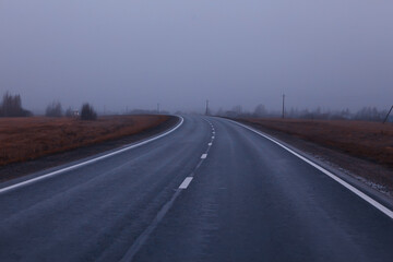 road in fog concept, mist in october halloween landscape, highway