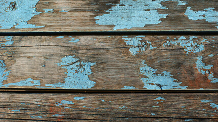 old dirty wooden planks with cracked blue paint