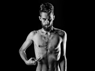 Fototapeta na wymiar Man dieting with serious face and bare slim or thin body. Chest and torso with anorexia isolated on black background.