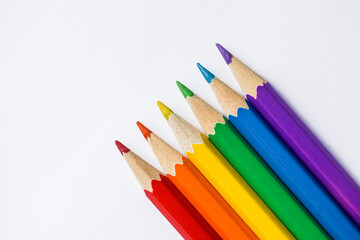 Colored Rainbow Pencils school supplies on white background. Copy space