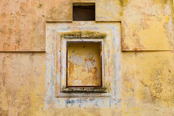 Italy, Basilicata, Province of Matera, Matera. Yellow wall and window.