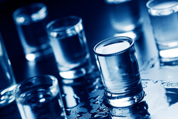 Vodka in shot glasses on bar. close up