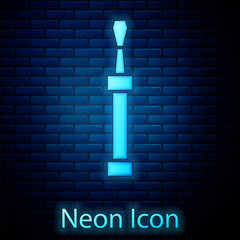 Glowing neon Screwdriver icon isolated on brick wall background. Service tool symbol. Vector.