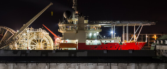 RED SHIP WITH A HELIPAD - Pipe laying vessel moored in seaport
 - obrazy, fototapety, plakaty