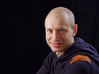 Obraz premium portrait of a bald man on a black background