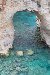 Italy, Apulia, Province of Lecce, Melendugno. Torre Sant'Andrea. Eroded limestone cliffs above the...