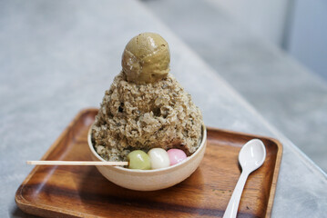 Houjicha (Japanese green tea) kakigori, shaved ice in Japanese style topped with houjicha ice-cream and three dango.