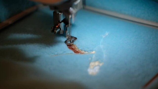 High speed computerised embroidery sewing machine in action.